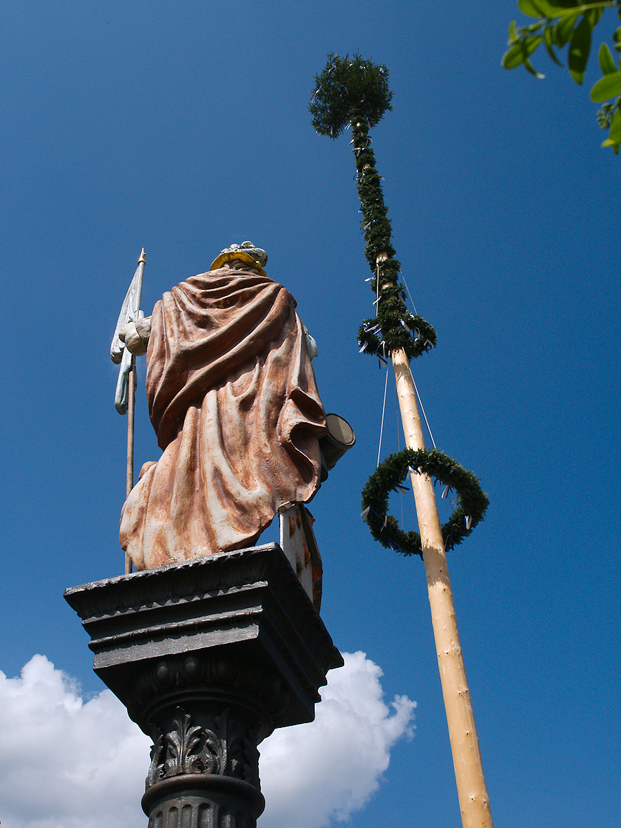 Maypole and St Florian statue. Tagged with 