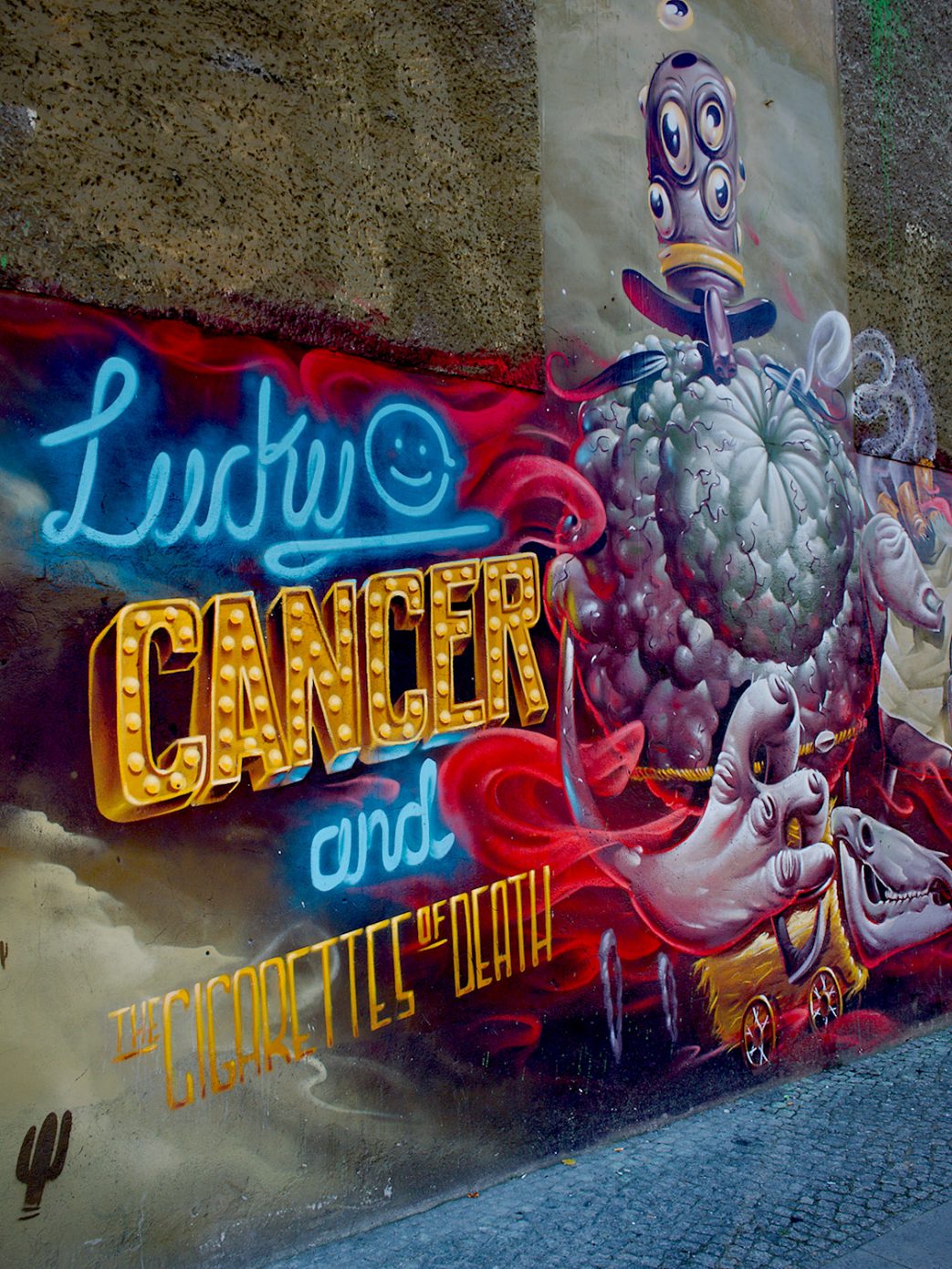 Lucky Cancer and the Cigarettes of Death. Tagged with Graffiti, Subject, Things, Urban