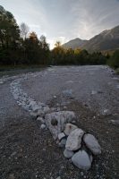 stone snake at the banks of river saalach